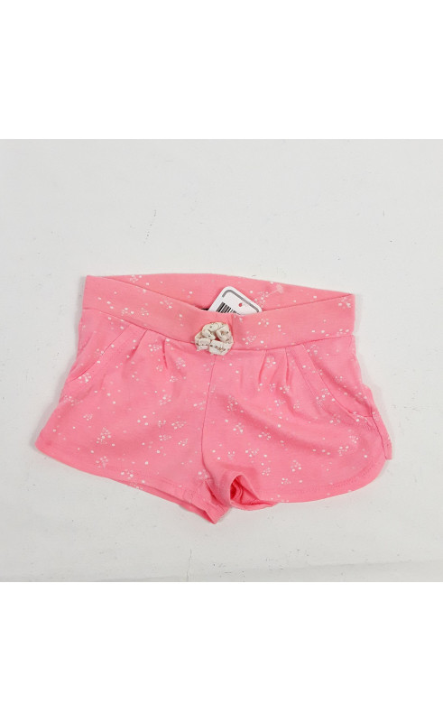 Short rose fluo avec point blanc et noeud blanc et doré