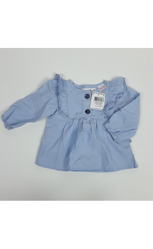 Blouse bleu clair avec bouton nacré